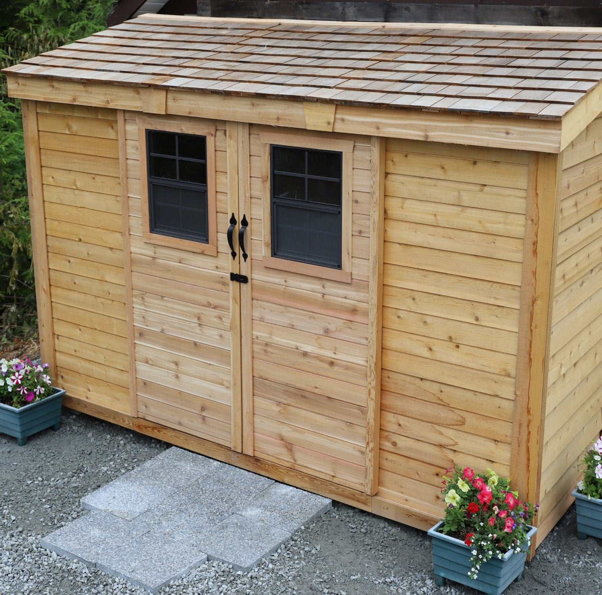 compact space cedar shed with natural wood siding, black-framed windows, double doors and shingle-style roof