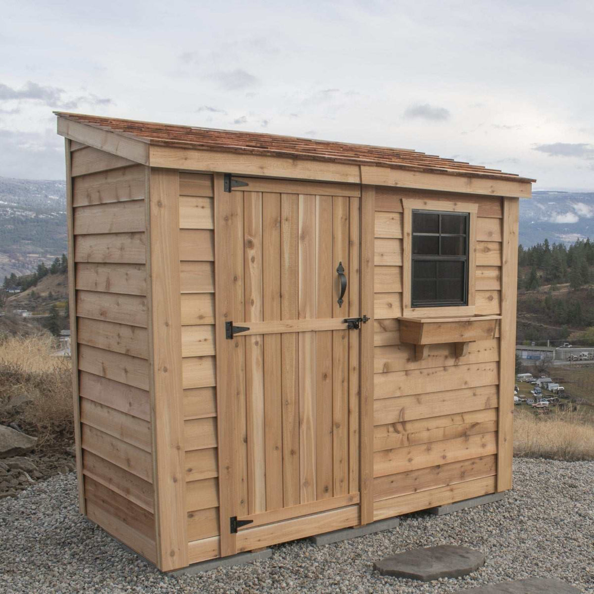 Cedar lean-to shed with a natural wood finish, single door, black hardware, window, and flower box featuring Panelized Wall Design